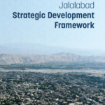 Cover page of the "Jalalabad Strategic Development Framework" document featuring an aerial view of Jalalabad city with a mountainous background.