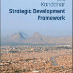 View of Kandahar city with mountains in the background, featuring the Kandahar Strategic Development Framework cover