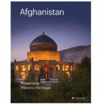 Book cover of 'Afghanistan: Preserving Historic Heritage,' published by Prestel, featuring a lit historic domed structure against a mountainous backdrop.