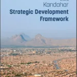 View of Kandahar city with mountains in the background, featuring the Kandahar Strategic Development Framework cover