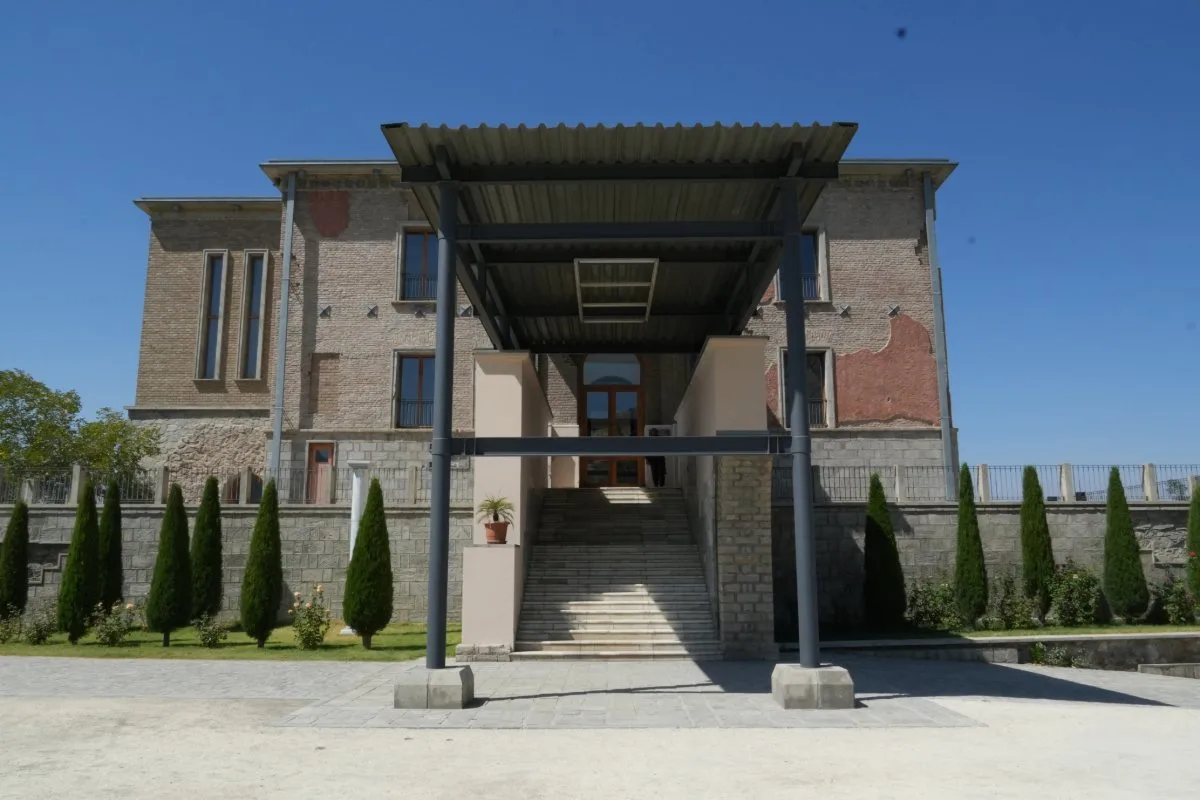 Entrance to the Chihlsatoon Palace in Afghanistan, featuring modern architectural elements blended with traditional design.